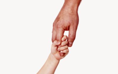 Photo of a father's hand holding a small child's hand to illustrate the article Fumbling Through Parenthood: What Becoming a Dad Has Taught Me About God