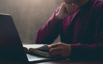 Photo of a person reading a Bible to illustrate the article 
