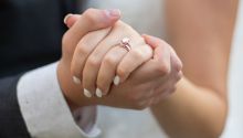Photo of the hands of the couple at their wedding, to illustrate the article Lessons From 204 Years of Marriage.